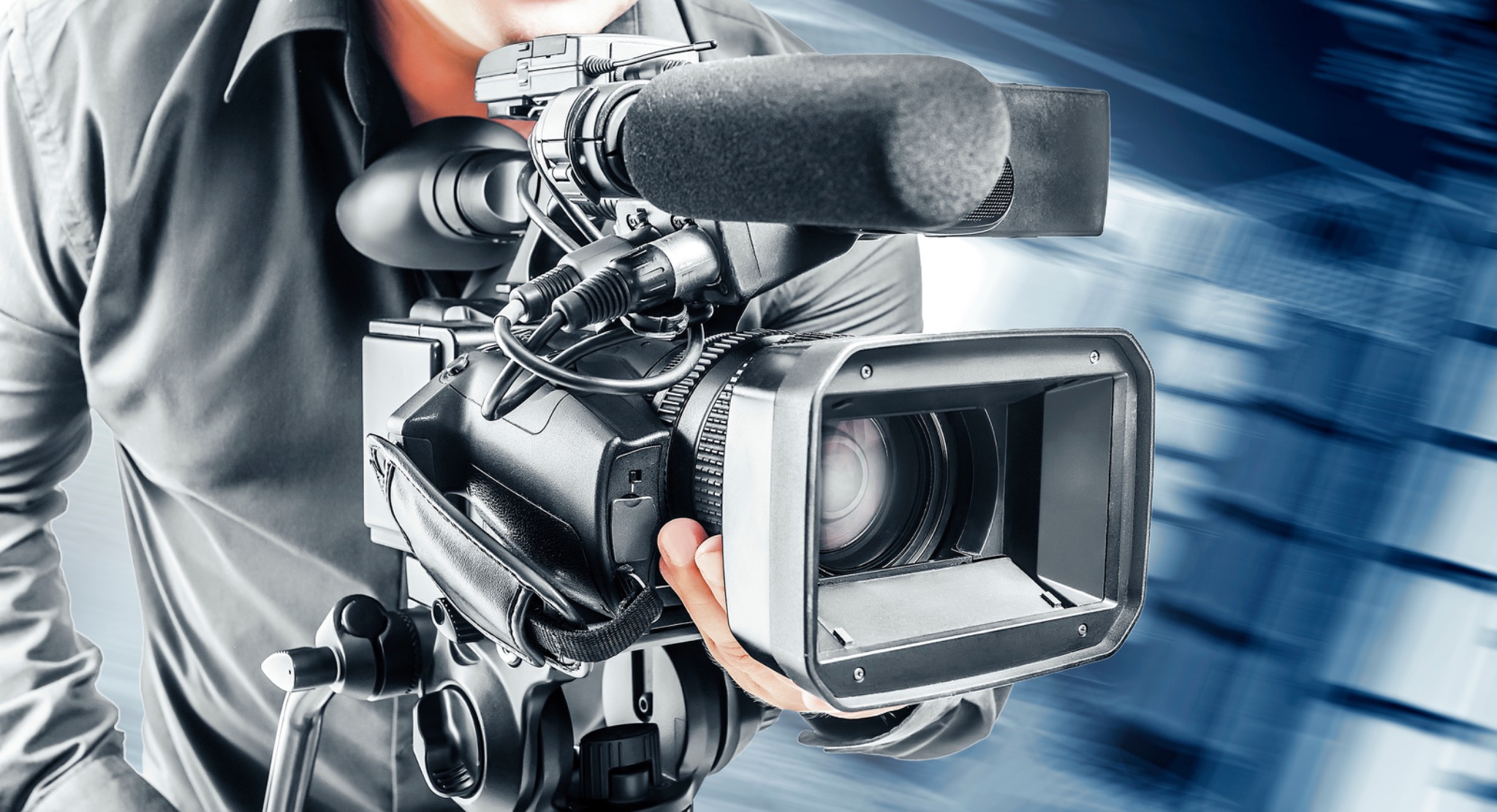 Video operator filming with a professional camera